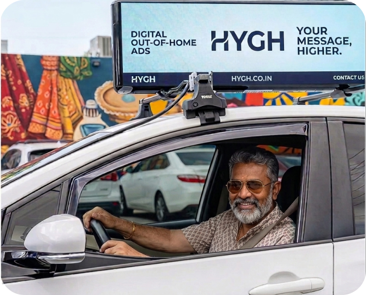 Driver sitting in car with HYGH billboard mounted on rooftop